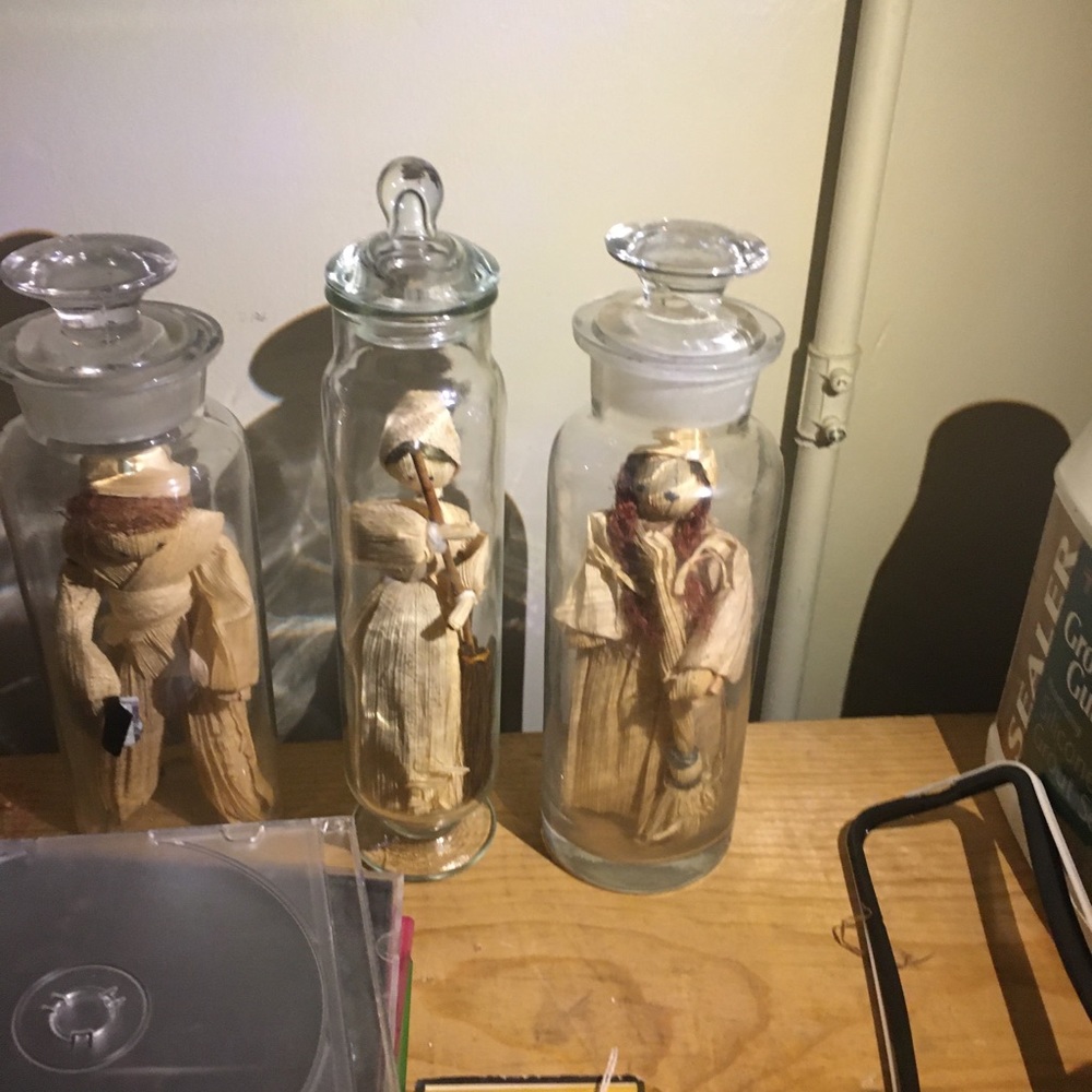 Corn husk dolls in bottles
